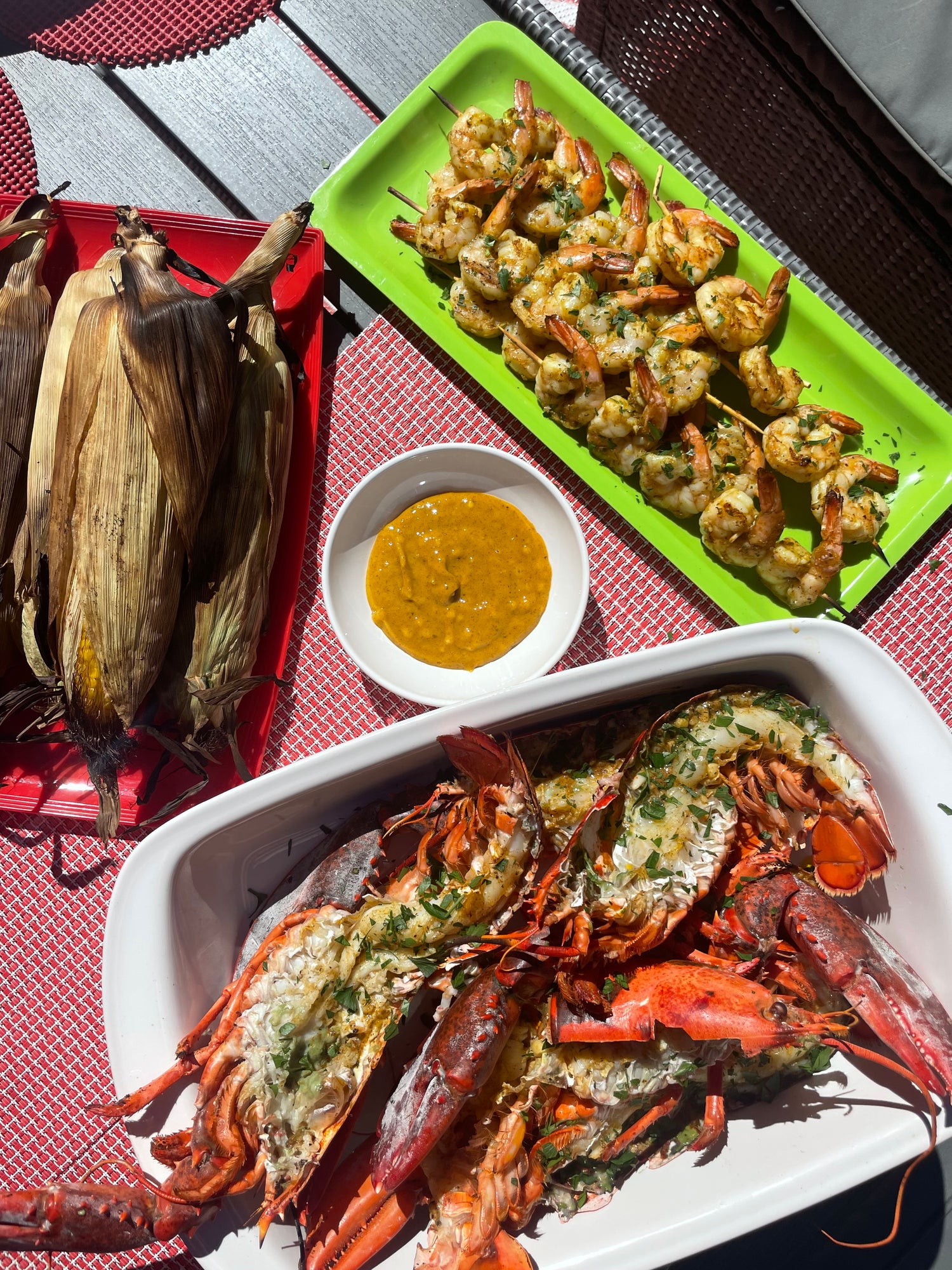 Grilled corn, grilled lobster, sazón butter, grilled shrimp, skewers, rooftop