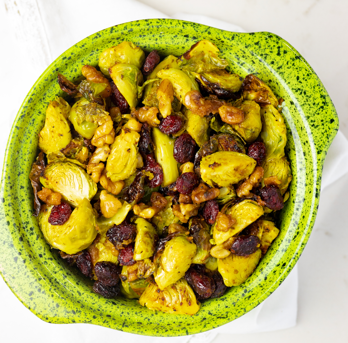 Sofrito Brussels Sprouts with Candied Sazón Walnuts